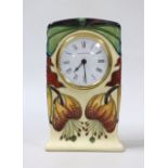 A boxed Moorcroft mantel timepiece, 16cm high