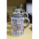 Four 18th century German faience lidded tankards and a salt glazed tankard, all with hinged pewter