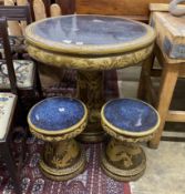 A Chinese style circular glazed earthenware garden table, diameter 80cm, height 76cm and two stools