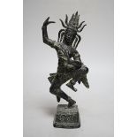 A Khmer style bronze figure of a deity, 24cm high