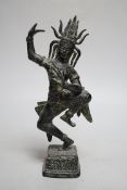 A Khmer style bronze figure of a deity, 24cm high