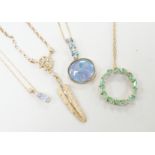 Three assorted modern 9ct or yellow metal and gem set pendants, on 9ct chains including opal doublet
