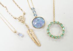 Three assorted modern 9ct or yellow metal and gem set pendants, on 9ct chains including opal doublet