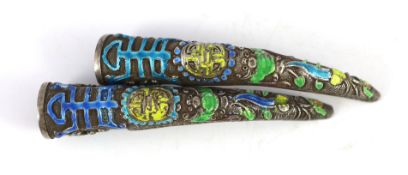 A pair of Chinese silver and enamel nail guards, late Qing dynasty, 8.5cm