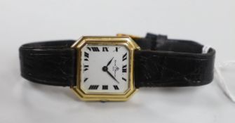 A lady's 750 yellow metal Baume & Mercier manual wind octagonal wrist watch, on a Baume & Mercier