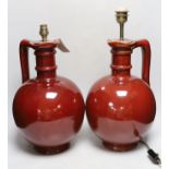 A pair of French wine flasks, converted to lamps, 40cm high