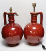 A pair of French wine flasks, converted to lamps, 40cm high