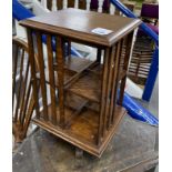 An early 20th century miniature oak revolving bookcase, width 26cm, height 43cm