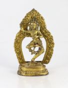A Sino-Tibetan gilt bronze figure of a deity, possibly 17th/18th century, 17 cm high