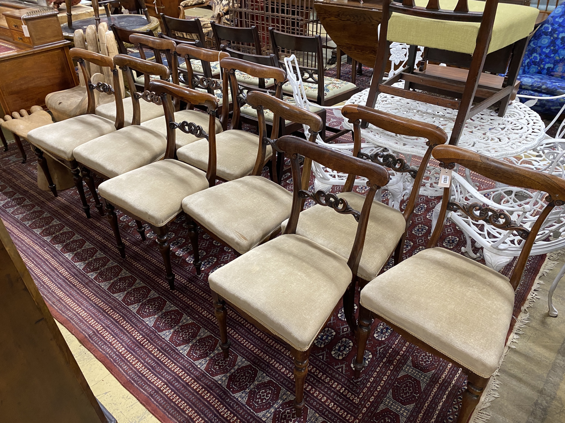 A set of ten early Victorian rosewood dining chairs with upholstered seats, width 44cm, height 82cm