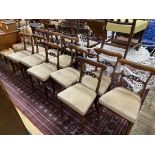 A set of ten early Victorian rosewood dining chairs with upholstered seats, width 44cm, height 82cm