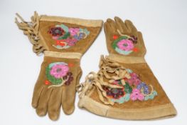 A pair of early 20th century native American suede and beaded gauntlet gloves, 39cm long