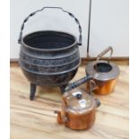 An iron cauldron, a toasting iron, a brass coal bucket and two copper kettles, cauldron 33cm high (