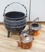An iron cauldron, a toasting iron, a brass coal bucket and two copper kettles, cauldron 33cm high (