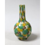 A small Chinese polychrome bottle vase, 13.5cm high