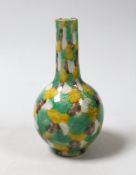 A small Chinese polychrome bottle vase, 13.5cm high