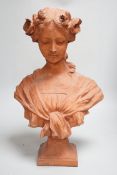 An Art Nouveau-style terracotta portrait bust of a young girl, 46cm high