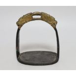 A Chinese cast iron stirrup, with dragon decoration, 16cm high