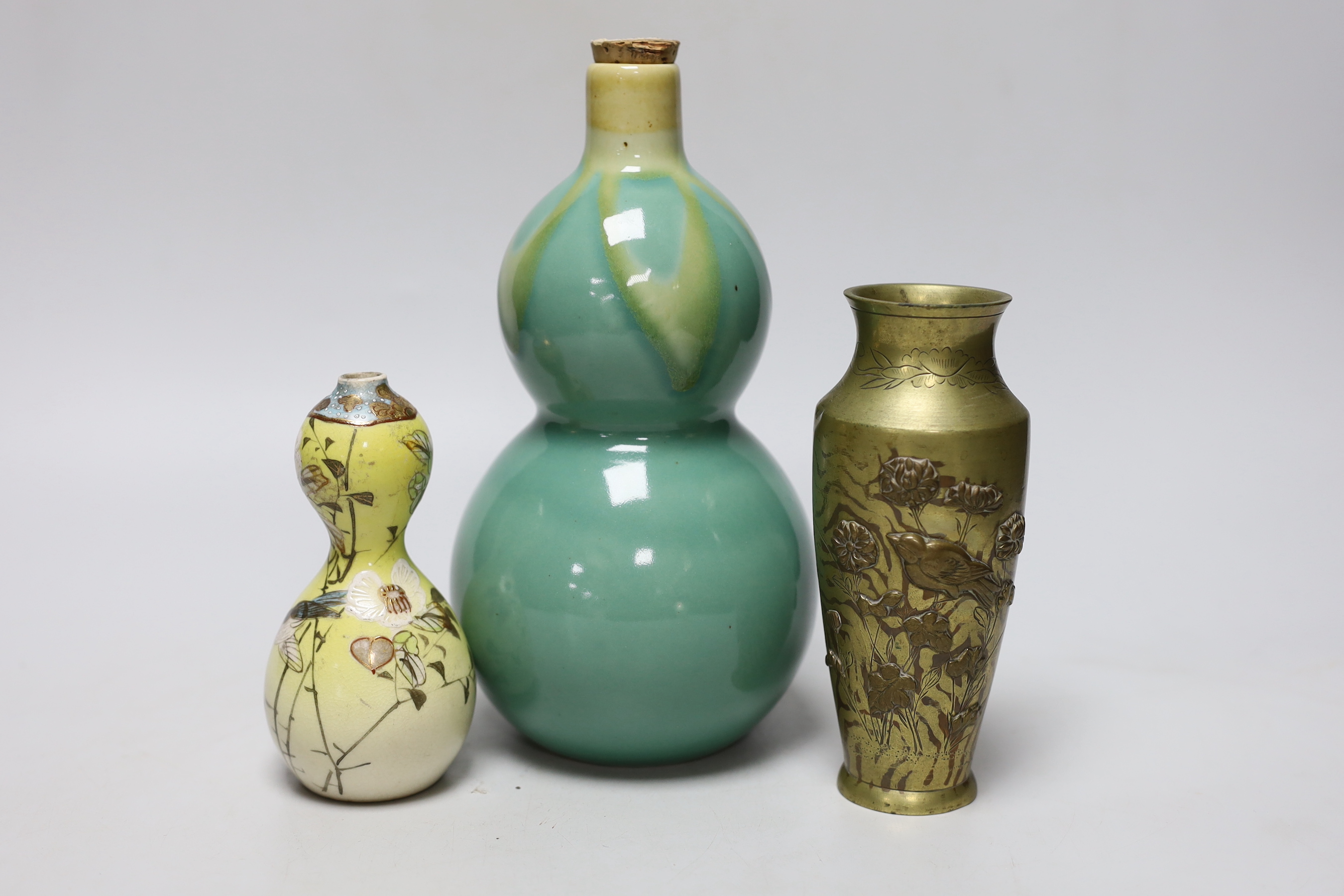 A Japanese bronze faux bois vase, a Satsuma vase and a porcelain tokkuri, a faux bois vase 15cm high