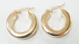 A pair of modern 14k yellow metal hoop earrings, 20mm, 5.8 grams.