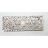 A 1920's white metal, pearl and diamond cluster set rectangular brooch, 43mm, gross weight 5.8