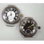 Two early 20th century silver manual wind wrist watches including black dial, both with subsidiary