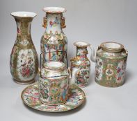A collection of Chinese Cantonese famille rose vases, two teapots and a plate