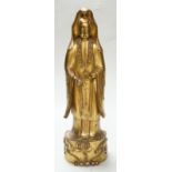 A Chinese or Japanese gold lacquered wood model of Guanyin, 19th century, 32cm