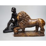 A bronze figure of a seated female dancer and a model of a lion, dancer 29cm high