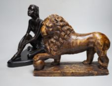 A bronze figure of a seated female dancer and a model of a lion, dancer 29cm high