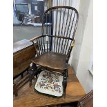 An early 19th century Windsor elm and beech comb back armchair, width 48cm, depth 43cm, height