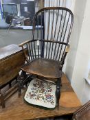 An early 19th century Windsor elm and beech comb back armchair, width 48cm, depth 43cm, height