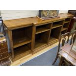 A Regency style banded inlaid walnut breakfront dwarf bookcase, width 266cm, depth 45cm, height