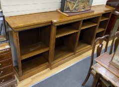 A Regency style banded inlaid walnut breakfront dwarf bookcase, width 266cm, depth 45cm, height