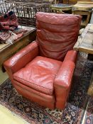A red leather armchair, width 88cm, depth 86cm, height 100cm
