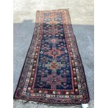 An antique South West Persian blue ground Luri runner, 291 x 114cm