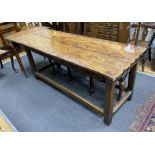 A late 17th / early 18th century elm two plank top refectory table (re-cleated), length 186cm, depth