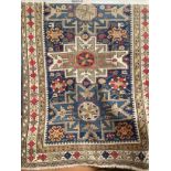 An antique Shirvan Lesghi design blue ground triple medallion rug 148cm x 106cm