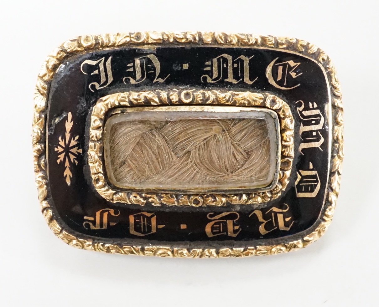 A William IV yellow metal, enamel and glazed plaited hair mourning brooch, with engraved inscription