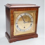 An Elliott walnut mantel clock, traditional dial and chiming movement, 25cm high