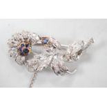 A modern white metal, sapphire and diamond chip set floral spray brooch, 43mm, gross weight 8.8