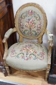 A 19th century French giltwood and composition fauteuil with tapestry upholstery, width 59cm,