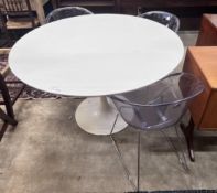 Three Habitat perspex armchairs and a Habitat ‘’Chelsea’’ circular white laminated wood table,