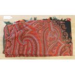 A 19th century Indian red ground paisley shawl with a blue 'fire' central medallion, 320 x 155cm