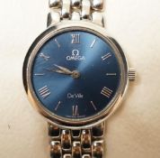 A lady's 1990's stainless steel Omega De Ville quartz wrist watch, with blue dial, box and papers.
