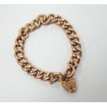 An Edwardian 9ct gold curb link bracelet, with heart shaped padlock clasp, 19cm, 16.2 grams.