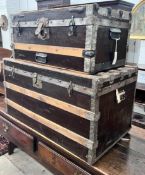Two wood and metal bound travelling trunks, larger length 86cm, depth 48cm, height 47cm