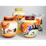 Two Clarice Cliff reproduction Bizarre designed jars, a vase and a jug (decoration a.f.), tallest