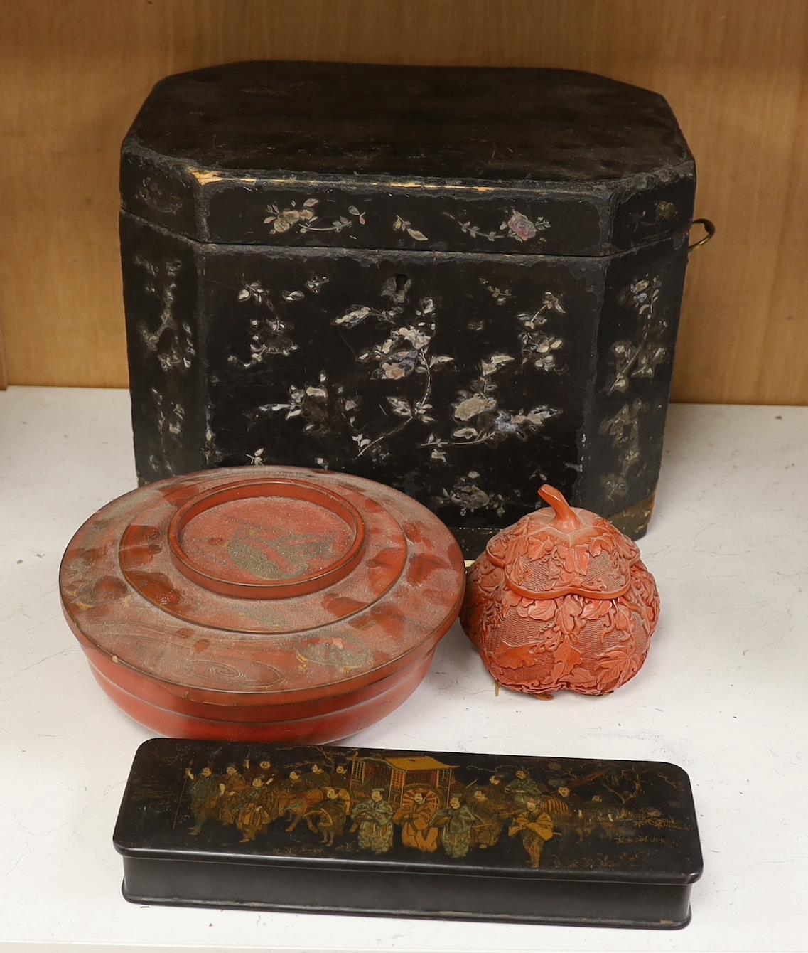 A Chinese black lacquer and mother of pearl box, two red lacquer boxes and a Chinoiserie painted