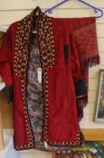 A Tekke Turkoman woman's red ground robe (khalat), the collar embroidered with red, gold and white